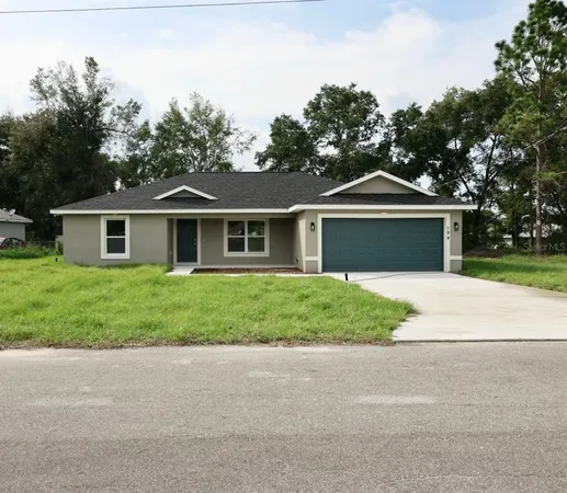 a front view of a house with yard