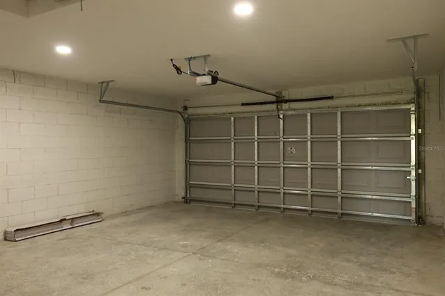 a view of a yard with a large tree