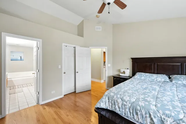 a bedroom with a bed and a dresser