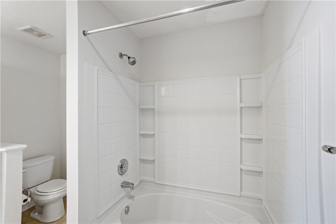 4294 Straight Arrow Road Dayton, OH 45430 - Photo 28 of 41 This bright bathroom features a pristine bathtub and shower, ready for daily rejuvenation.
