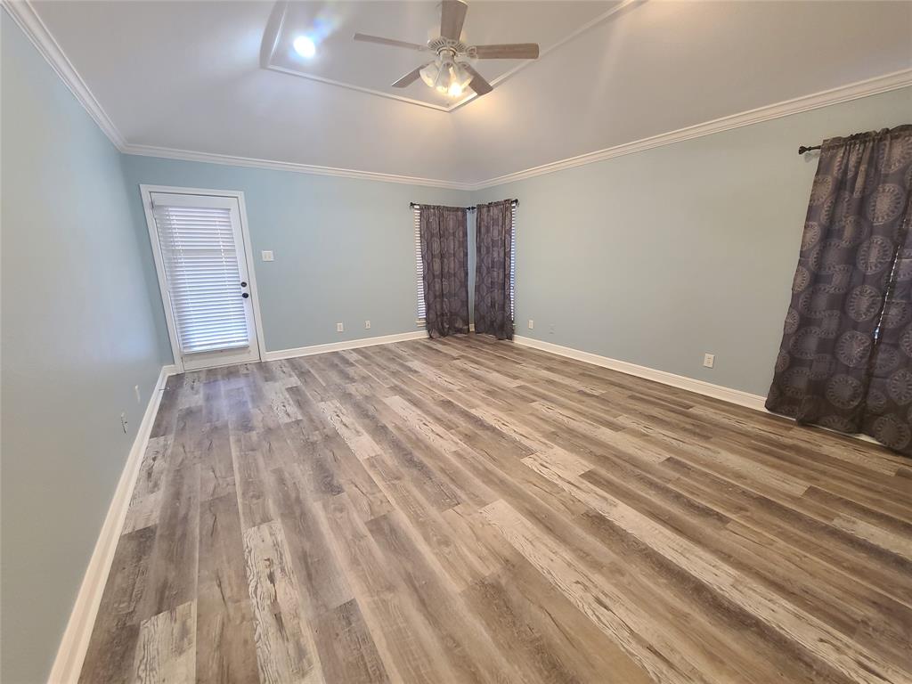 8921 Bontura Road Granbury, TX 76049 - Photo 12 of 26 a view of empty room with wooden floor