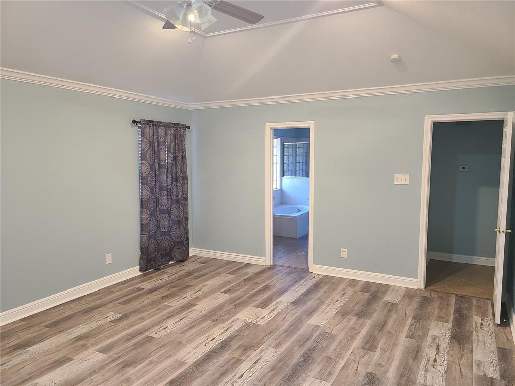 8921 Bontura Road Granbury, TX 76049 - Photo 14 of 26 a view of empty room with window and ceiling fan