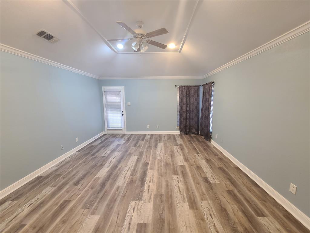 8921 Bontura Road Granbury, TX 76049 - Photo 16 of 26 a view of empty room with wooden floor