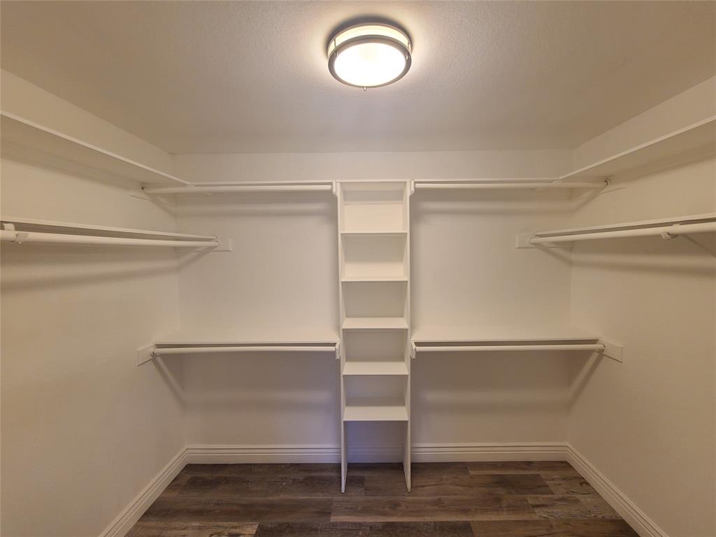 8921 Bontura Road Granbury, TX 76049 - Photo 17 of 26 a view of walk in closet with empty racks