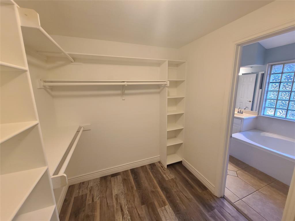 8921 Bontura Road Granbury, TX 76049 - Photo 18 of 26 a view of an empty walk in closet