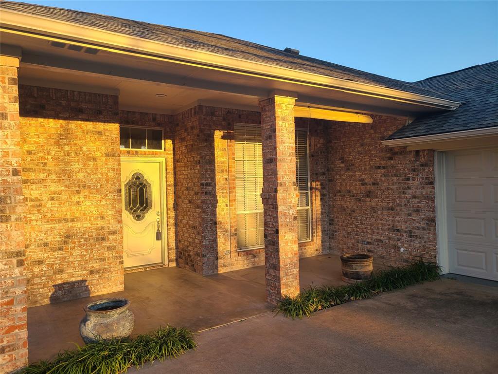 8921 Bontura Road Granbury, TX 76049 - Photo 2 of 26 a view of door with patio