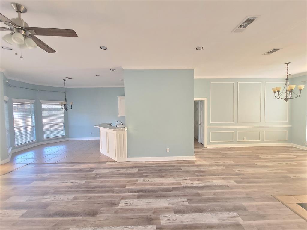 8921 Bontura Road Granbury, TX 76049 - Photo 5 of 26 a view of a room with a sink and a window