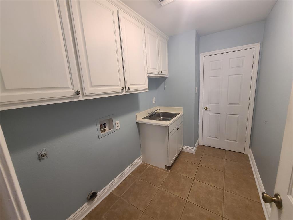 8921 Bontura Road Granbury, TX 76049 - Photo 9 of 26 a view of storage and utility room with washer and dryer