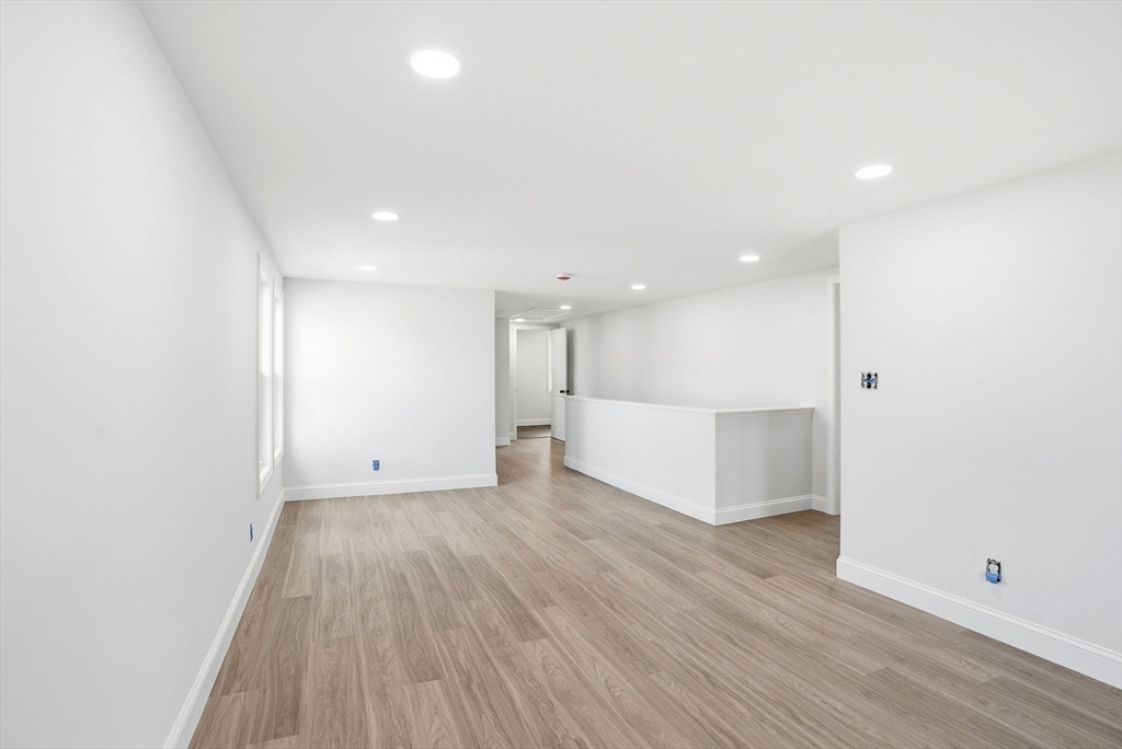 357 Wareham Street Middleboro, MA 02346 - Photo 23 of 42 a view of an empty room with wooden floor