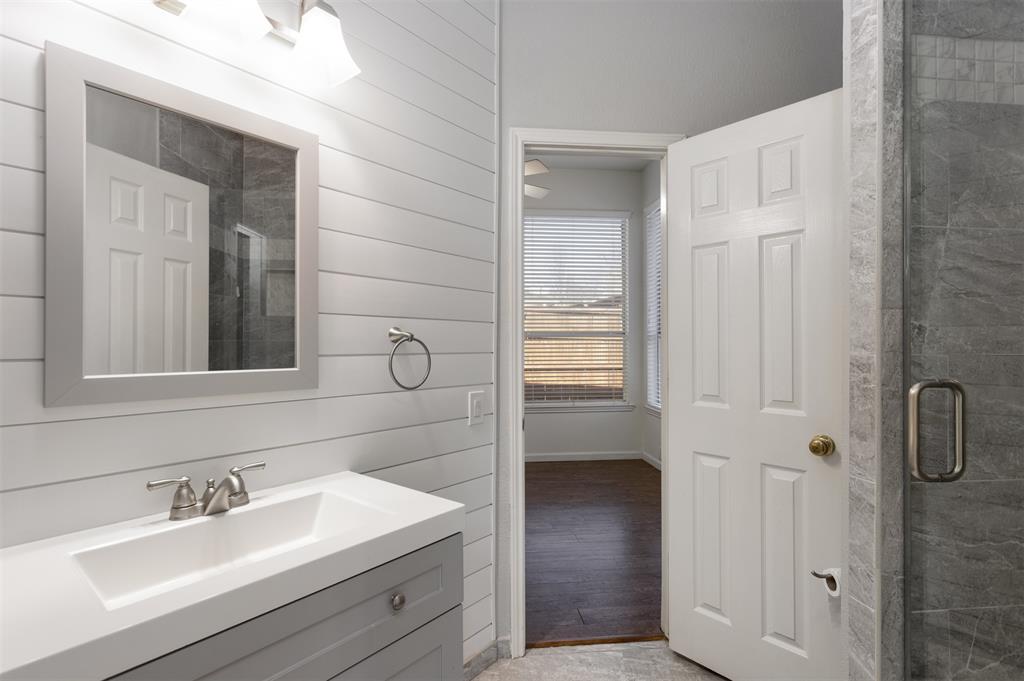 3306 Harbor Pointe Drive Rowlett, TX 75088 - Photo 12 of 40 Updated full bath downstairs adjoins a bedroom and also the hallway