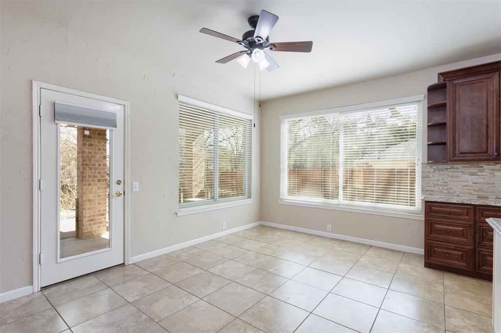 3306 Harbor Pointe Drive Rowlett, TX 75088 - Photo 13 of 40 Oversized kitchen dining space with large windows that overlook the patio and backyard