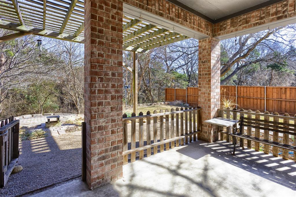 3306 Harbor Pointe Drive Rowlett, TX 75088 - Photo 29 of 40 Gated covered patio and pergola for taking in the serene yard, woods and small creek