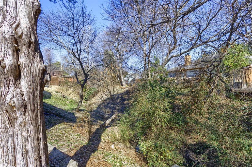 3306 Harbor Pointe Drive Rowlett, TX 75088 - Photo 31 of 40 Wooded area and small creek along the back side of the lot provides privacy and nature screen from your neighbors