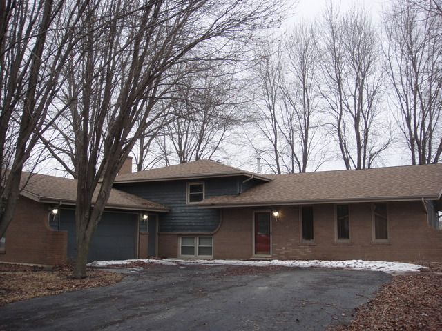 28W726 Wagner Road Naperville, IL 60564 - Photo 1 of 22 a front view of a house with yard and trees