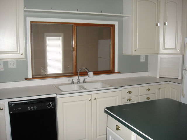 28W726 Wagner Road Naperville, IL 60564 - Photo 16 of 22 a kitchen with a sink dishwasher and white cabinets with wooden floor