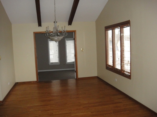 28W726 Wagner Road Naperville, IL 60564 - Photo 8 of 22 a view of empty room with wooden floor and fan