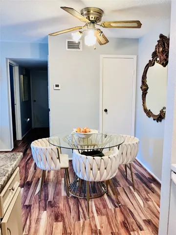 a bathroom with a sink vanity and a toilet