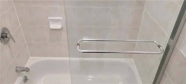 a bathroom with a bath tub