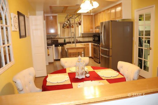 1624 South Farragut Street Ridgecrest, CA 93555 - Photo 11 of 43 a dining room with a table and chairs