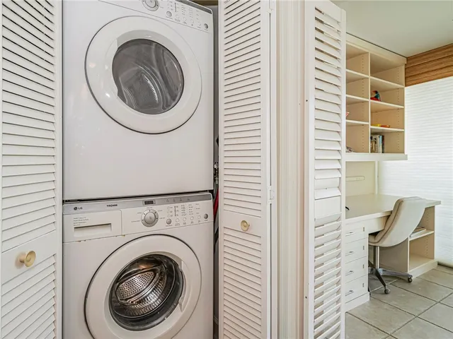 a view of a hallway with washer and dryer