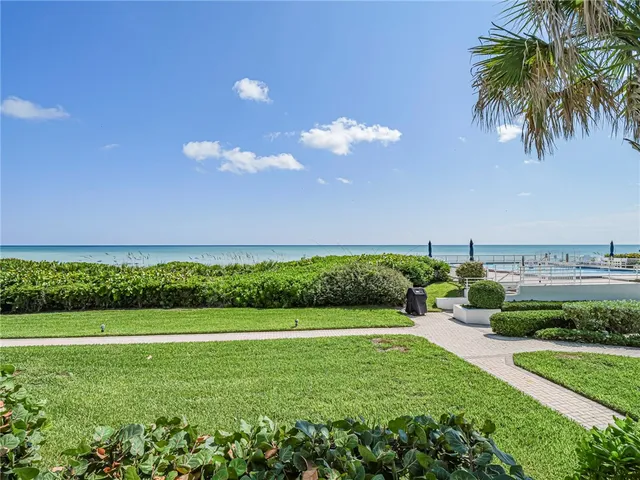 a view of a garden with a house