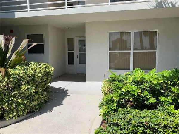 a flower plants in front of a house
