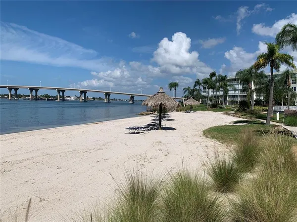 a view of a swimming pool and lounge chair