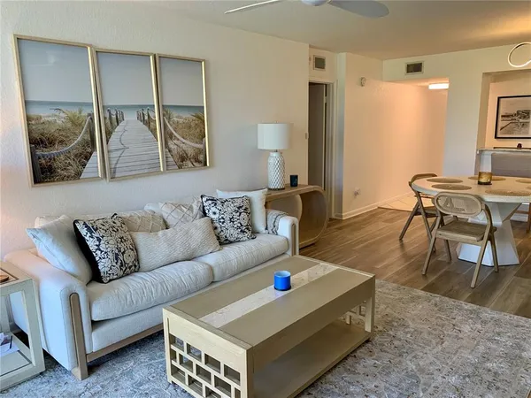 a living room with furniture and a table