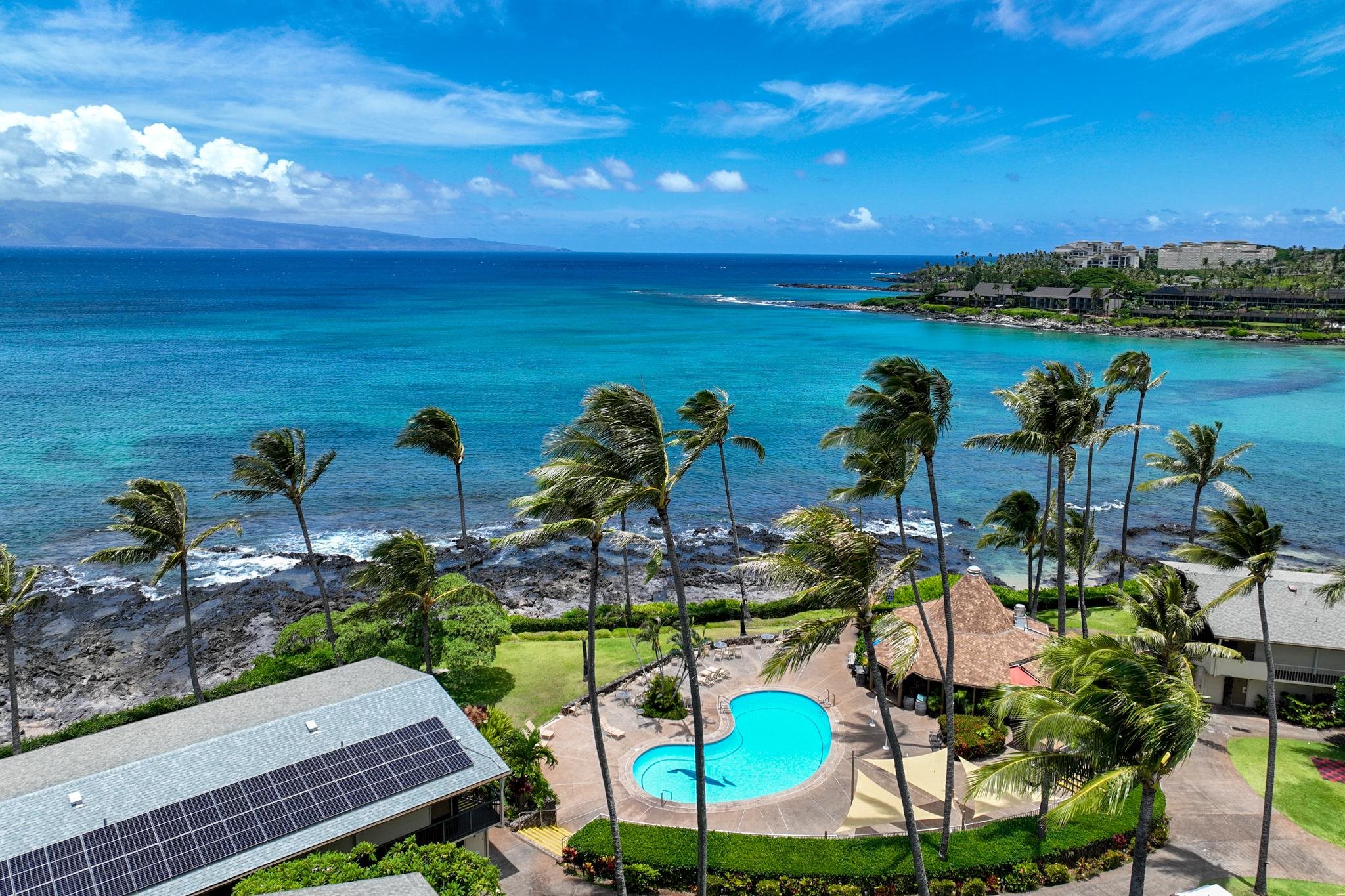 5315 Lower Honoapiilani Road, Unit D128 Lahaina, HI 96761 - Photo 17 of 24 a view of a swimming pool with an outdoor seating