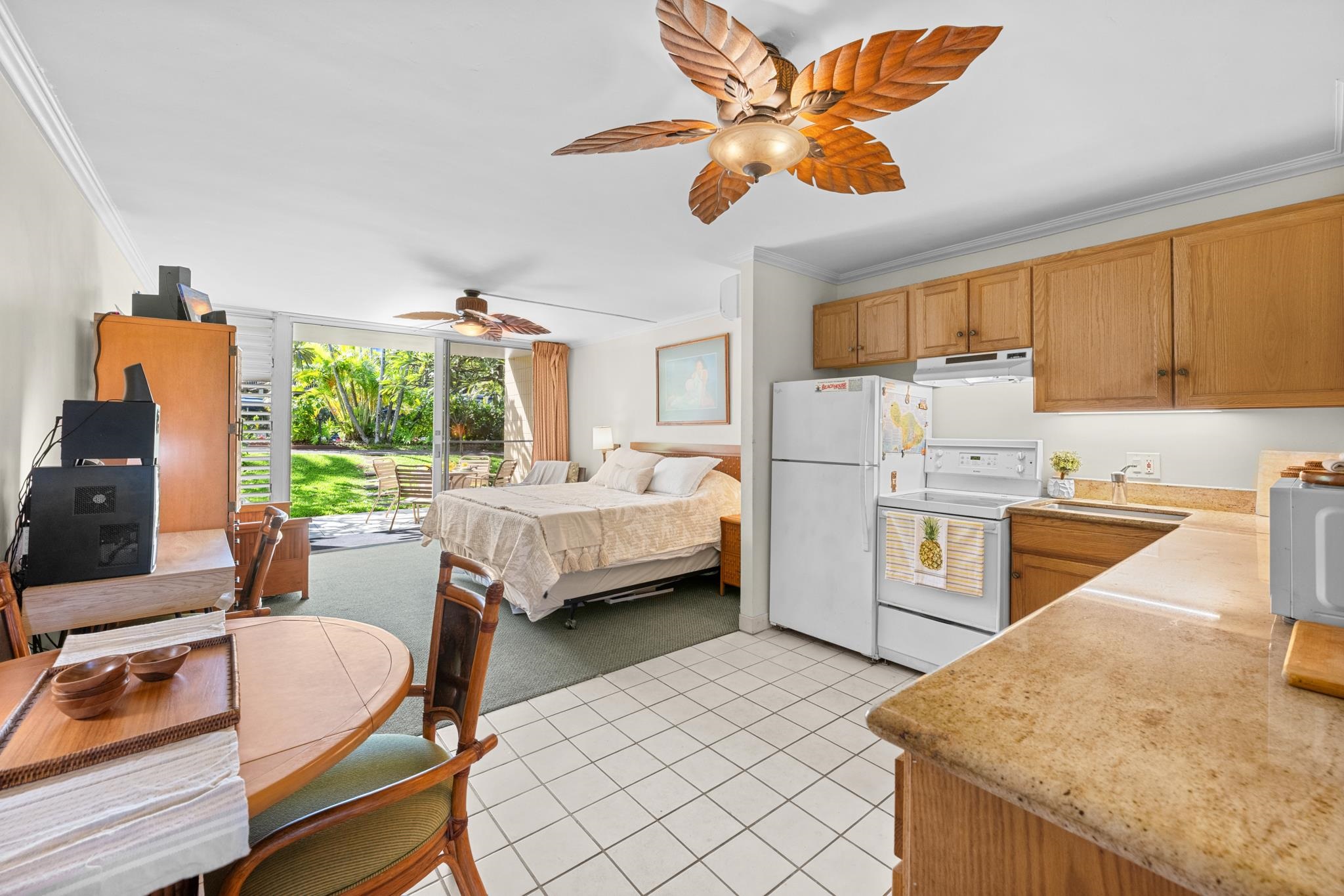 5315 Lower Honoapiilani Road, Unit D128 Lahaina, HI 96761 - Photo 7 of 24 a room with a bed furniture and a large window