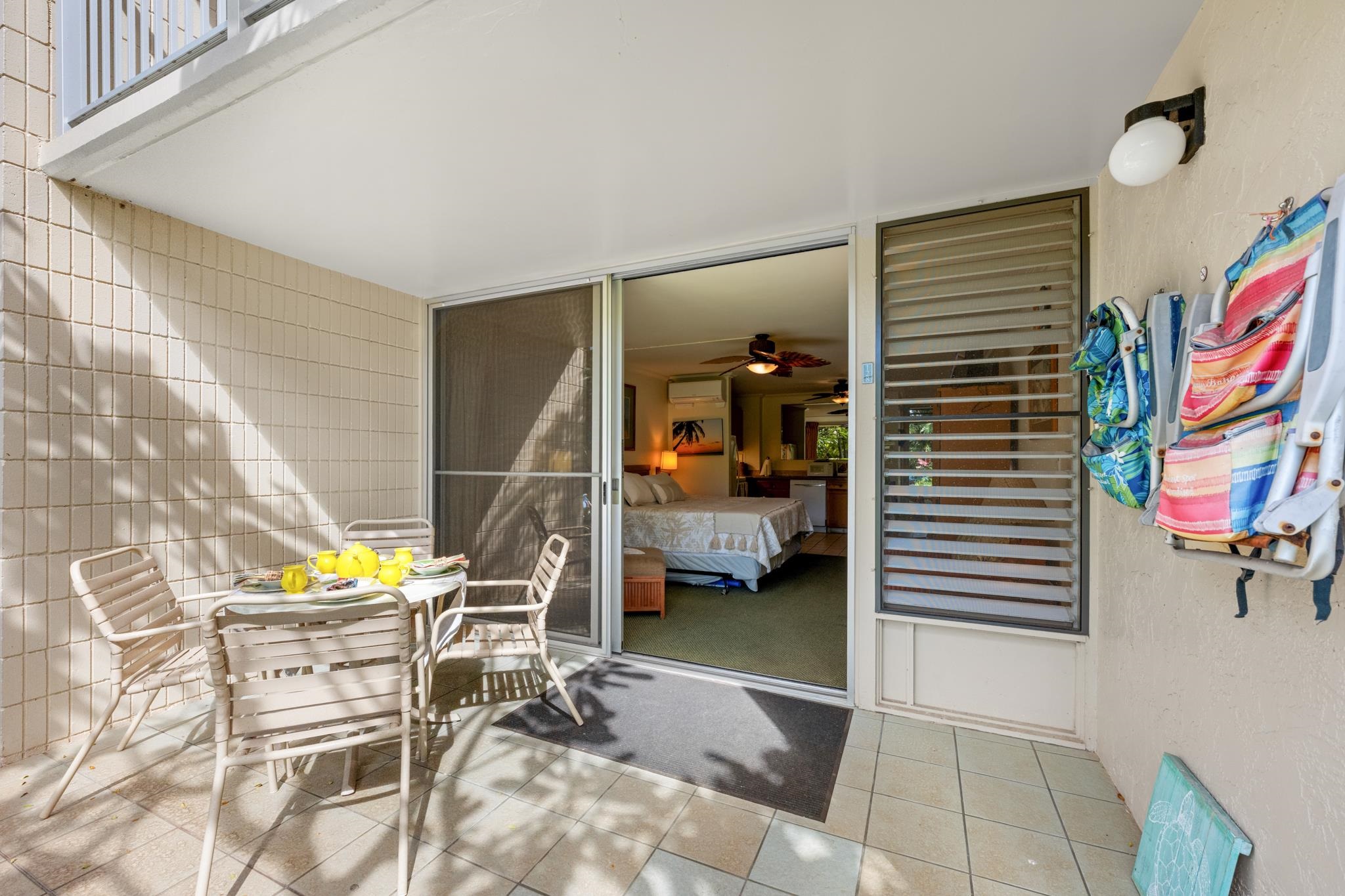 5315 Lower Honoapiilani Road, Unit D128 Lahaina, HI 96761 - Photo 9 of 24 a view of a room with a door and wooden floor