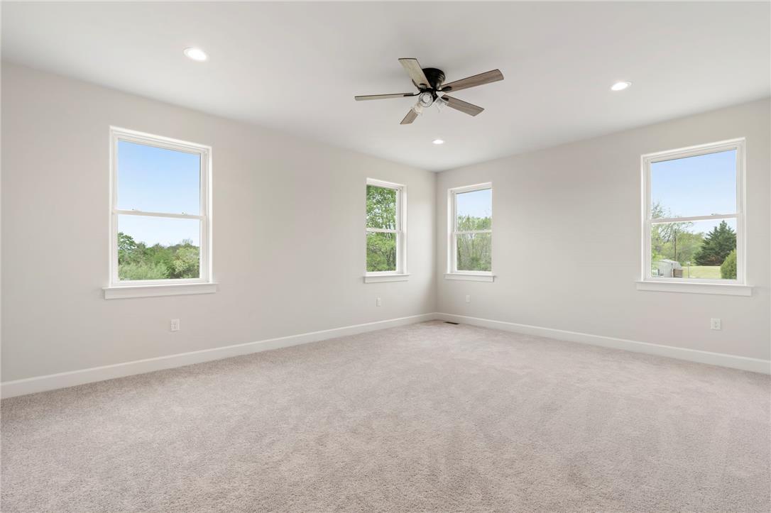Hottle Road Quakertown, PA 18951 - Photo 29 of 59 Plentiful windows frame peaceful tree-lined views in this airy bedroom with plush carpeting.