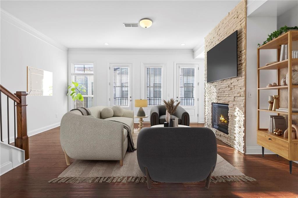 1752 Morningtide Lane Northeast Atlanta, GA 30324 - Photo 12 of 57 a living room with fireplace furniture and a flat screen tv