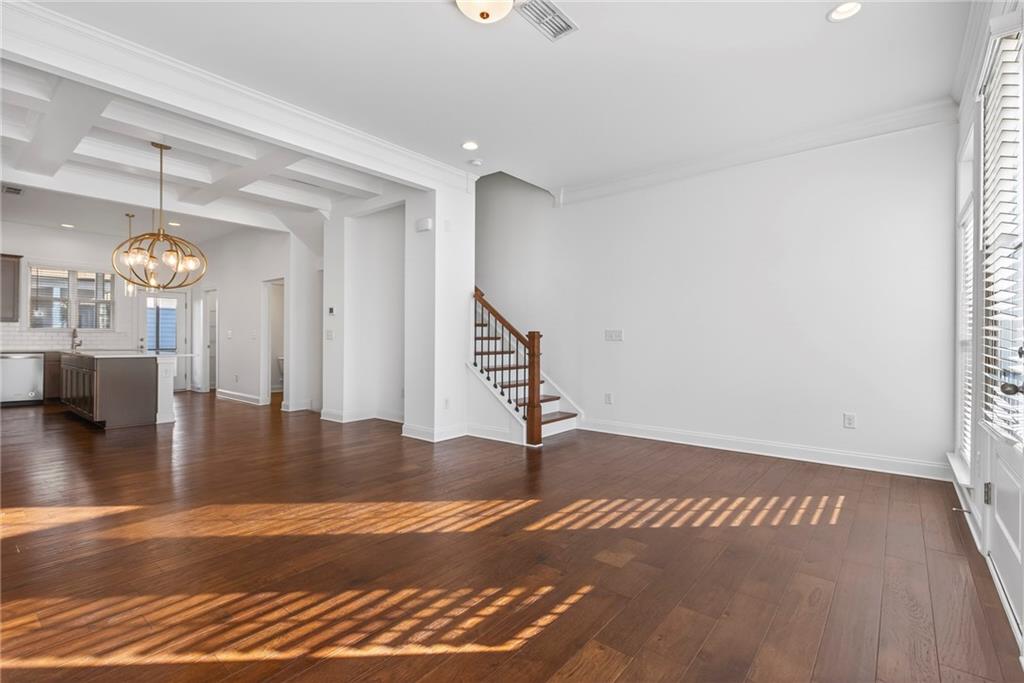 1752 Morningtide Lane Northeast Atlanta, GA 30324 - Photo 15 of 57 a view of a room with wooden floor and staircase