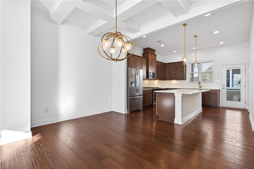 1752 Morningtide Lane Northeast Atlanta, GA 30324 - Photo 19 of 57 an open kitchen with a refrigerator and a stove top oven