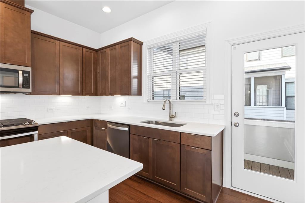 1752 Morningtide Lane Northeast Atlanta, GA 30324 - Photo 24 of 57 a kitchen with a sink and cabinets