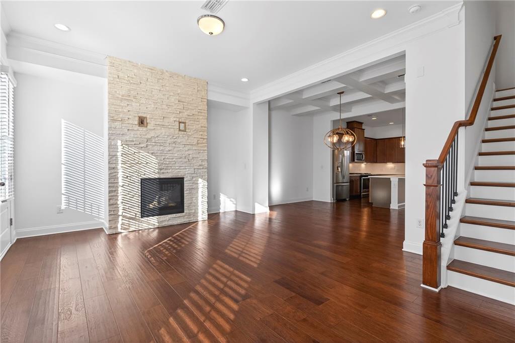 1752 Morningtide Lane Northeast Atlanta, GA 30324 - Photo 29 of 57 a view of a livingroom with wooden floor and fireplace