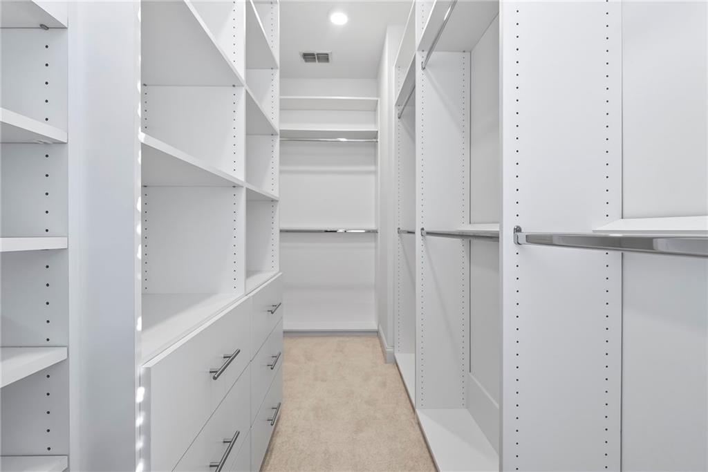 1752 Morningtide Lane Northeast Atlanta, GA 30324 - Photo 33 of 57 a view of walk in closet with empty racks