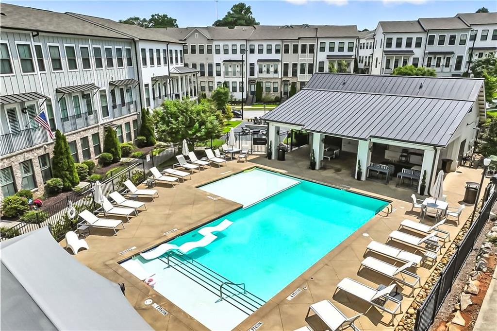 1752 Morningtide Lane Northeast Atlanta, GA 30324 - Photo 49 of 57 a view of a house with pool and chairs