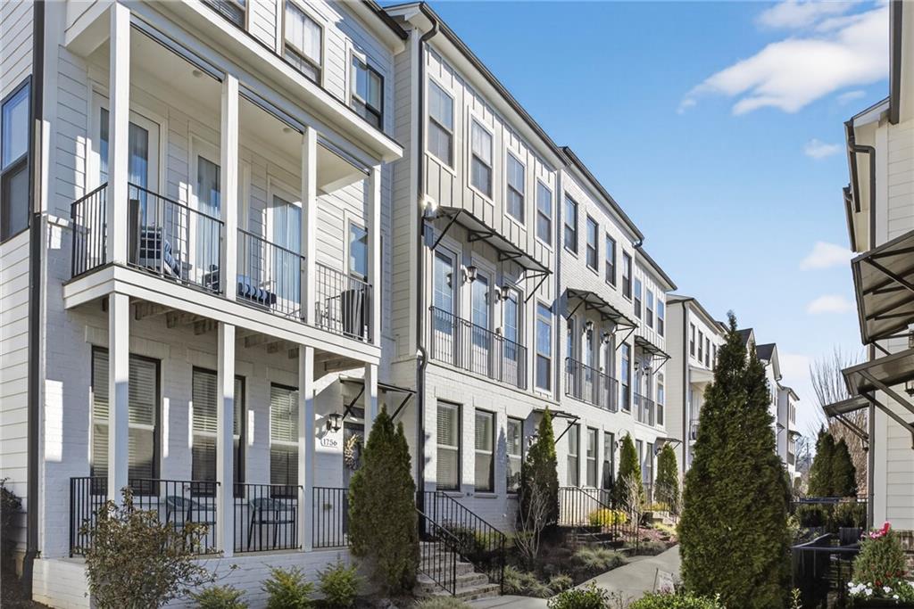 1752 Morningtide Lane Northeast Atlanta, GA 30324 - Photo 5 of 57 a front view of a building with a lot of windows