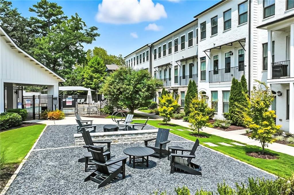 1752 Morningtide Lane Northeast Atlanta, GA 30324 - Photo 51 of 57 a view of a house with backyard sitting area and garden