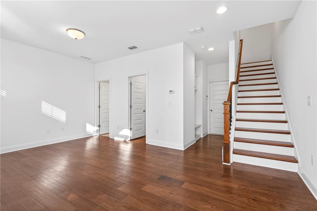1752 Morningtide Lane Northeast Atlanta, GA 30324 - Photo 6 of 57 a view of an empty room with wooden floor