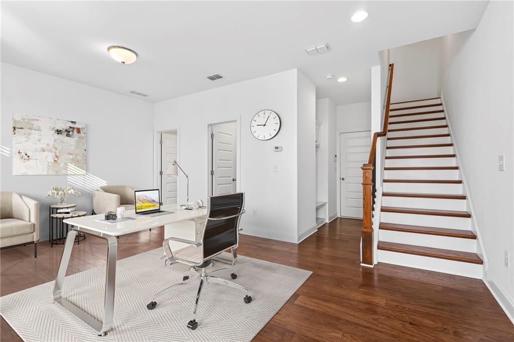1752 Morningtide Lane Northeast Atlanta, GA 30324 - Photo 7 of 57 a workspace with furniture and wooden floor