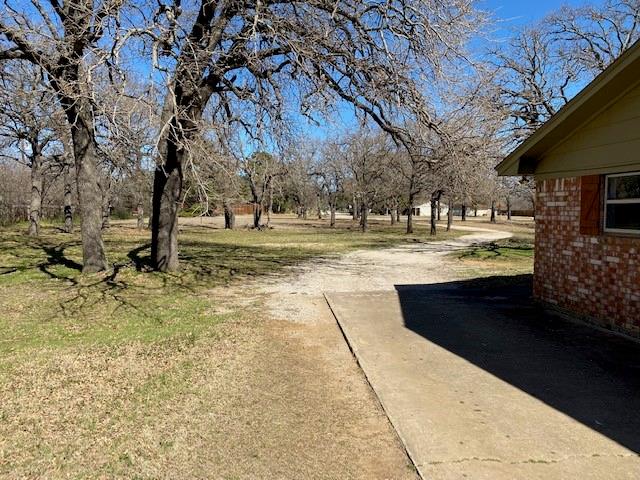 180 Highland Village Road Highland Village, TX 75077 - Photo 5 of 6 a view of yard with outdoor seating