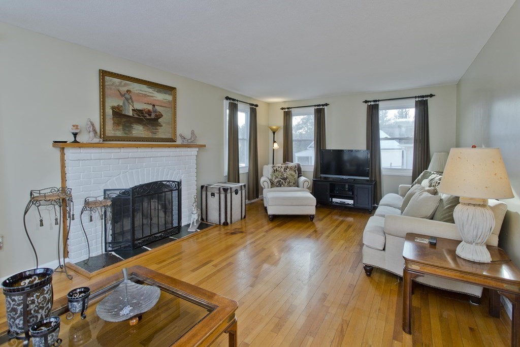 1161 Morgan Road West Springfield, MA 01089 - Photo 13 of 42 a living room with furniture and a fireplace