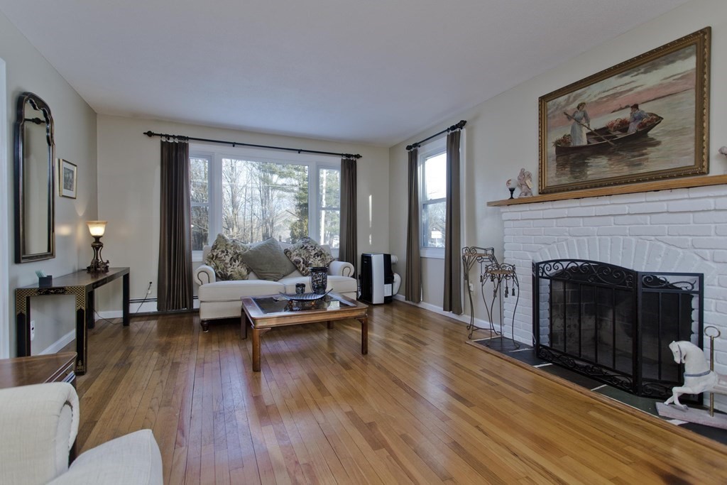1161 Morgan Road West Springfield, MA 01089 - Photo 14 of 42 a living room with furniture and a fireplace