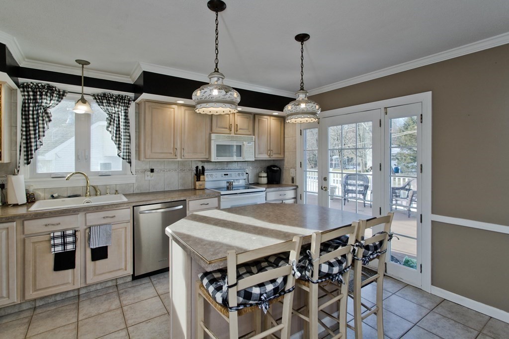 1161 Morgan Road West Springfield, MA 01089 - Photo 20 of 42 a kitchen with stainless steel appliances a stove a sink and a refrigerator