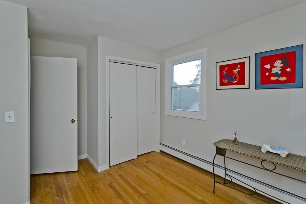 1161 Morgan Road West Springfield, MA 01089 - Photo 29 of 42 a view of a room with wooden floor and wardrobe