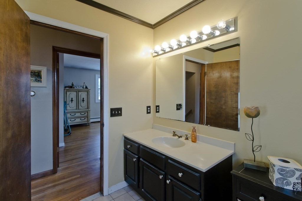 1161 Morgan Road West Springfield, MA 01089 - Photo 32 of 42 a bathroom with a sink a light fixture and a mirror