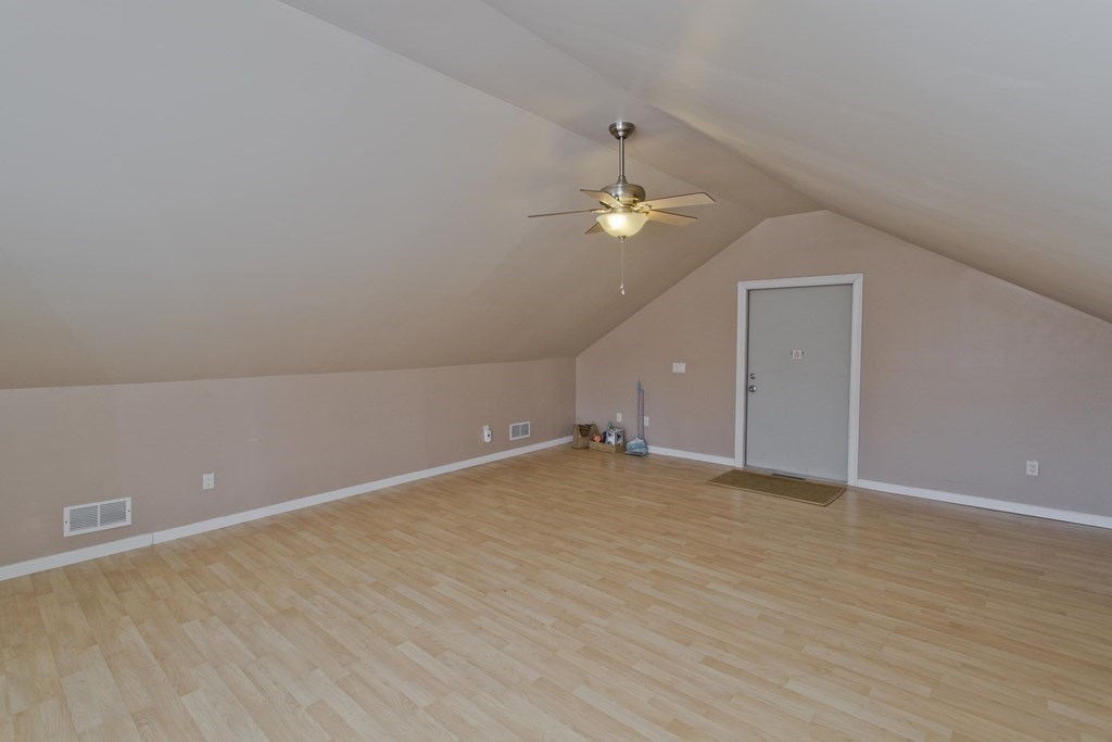 1161 Morgan Road West Springfield, MA 01089 - Photo 39 of 42 an empty room with a chandelier fan and wooden floor